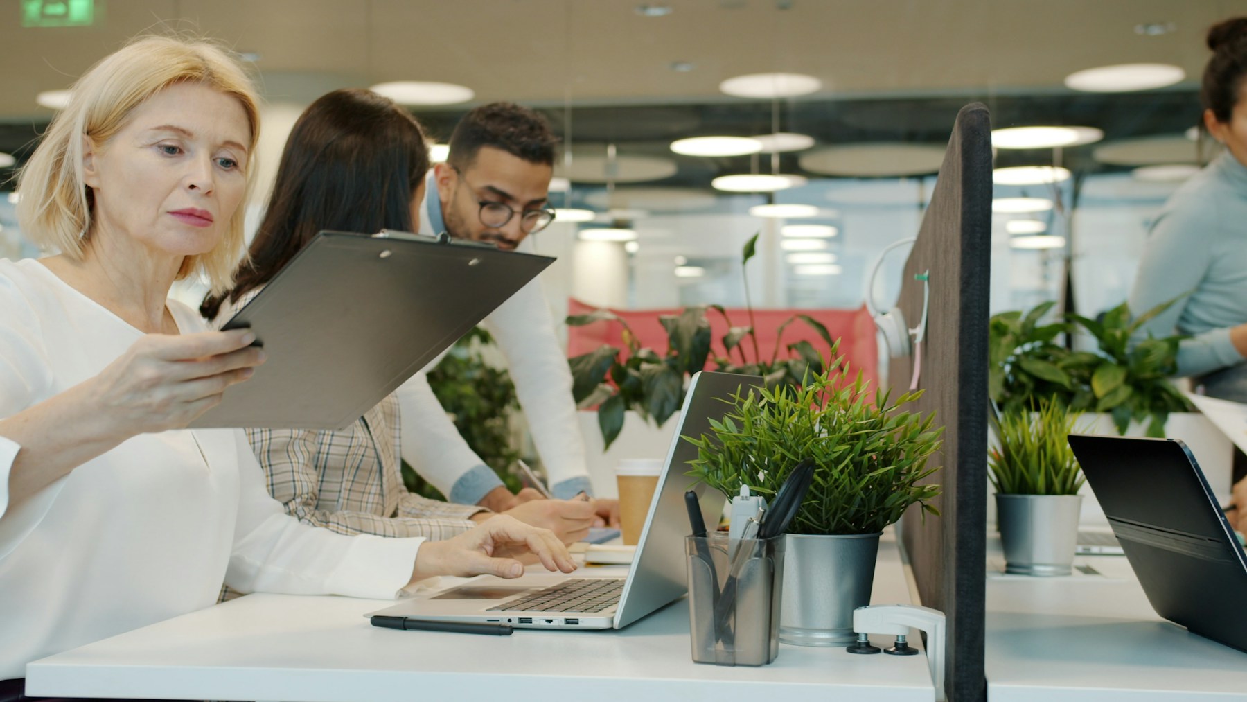 Colleagues collaborating in a modern office workspace